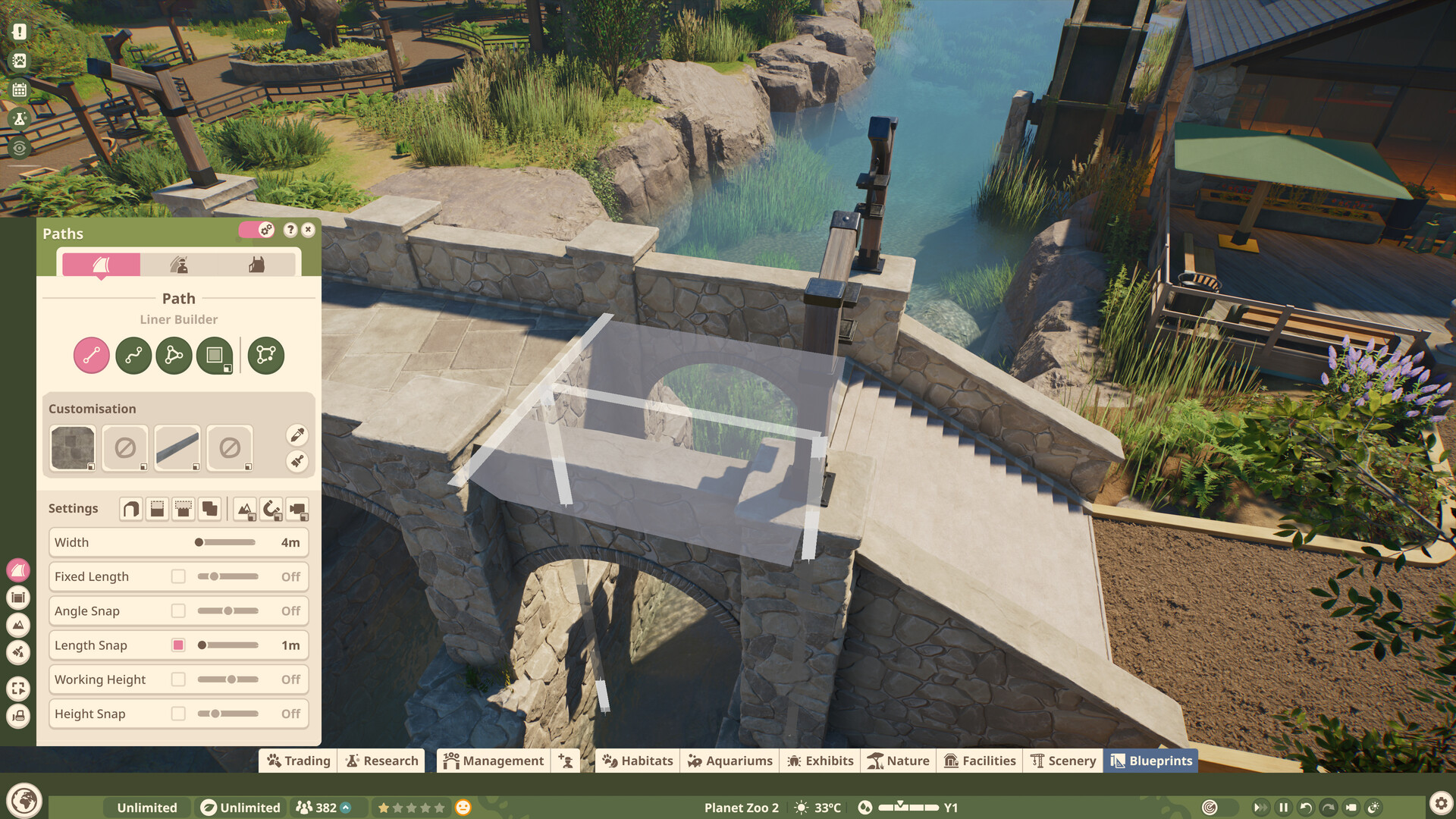 The path liner builder laying a guest walkway across a stone bridge, showing width and snapping settings