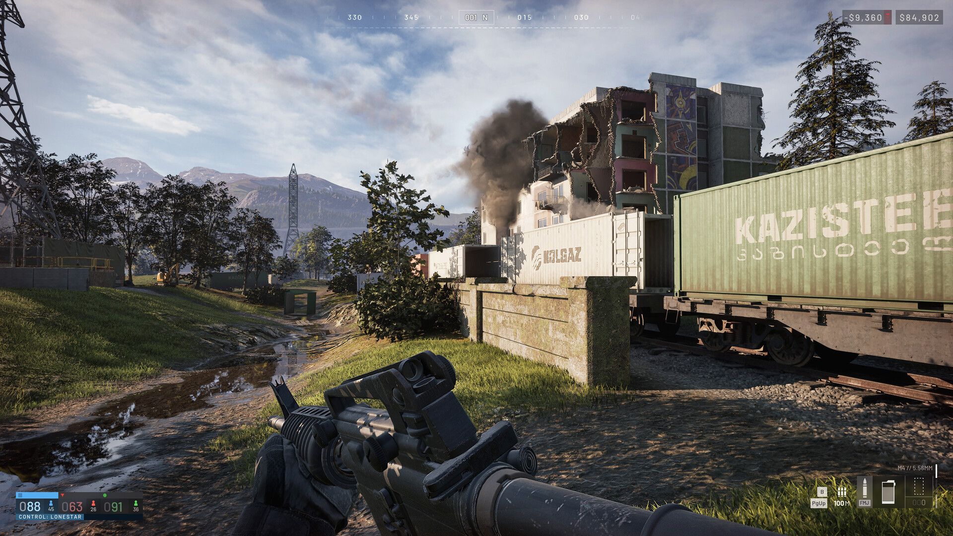 A first-person WARDOGS view past freight containers on a rail siding as a smoking apartment block sheds its front wall