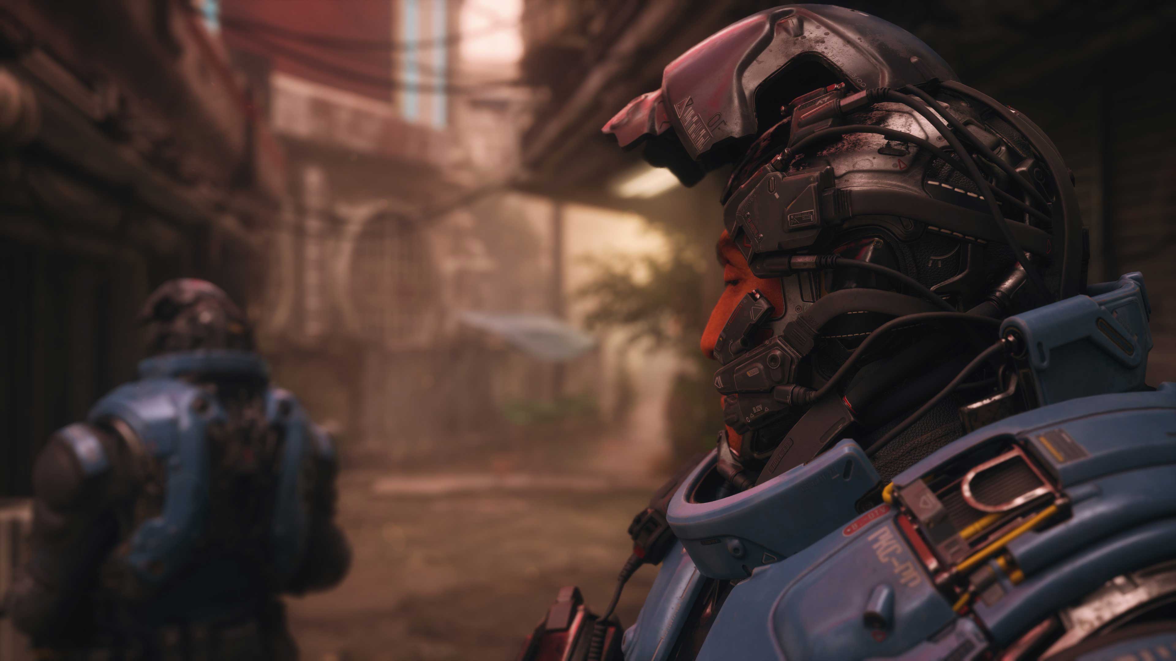 Two Peacekeepers in blue and grey powered armour standing in a narrow Port Desire alley