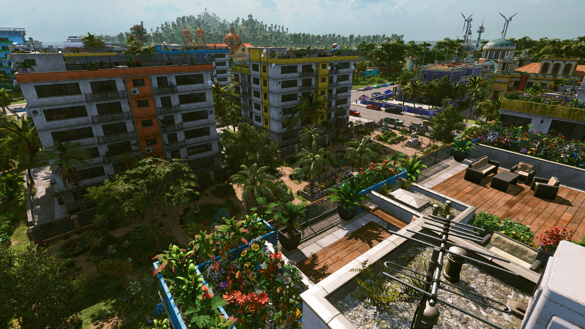 Tropico 7 apartment blocks and a rooftop garden terrace with wind turbines in the distance