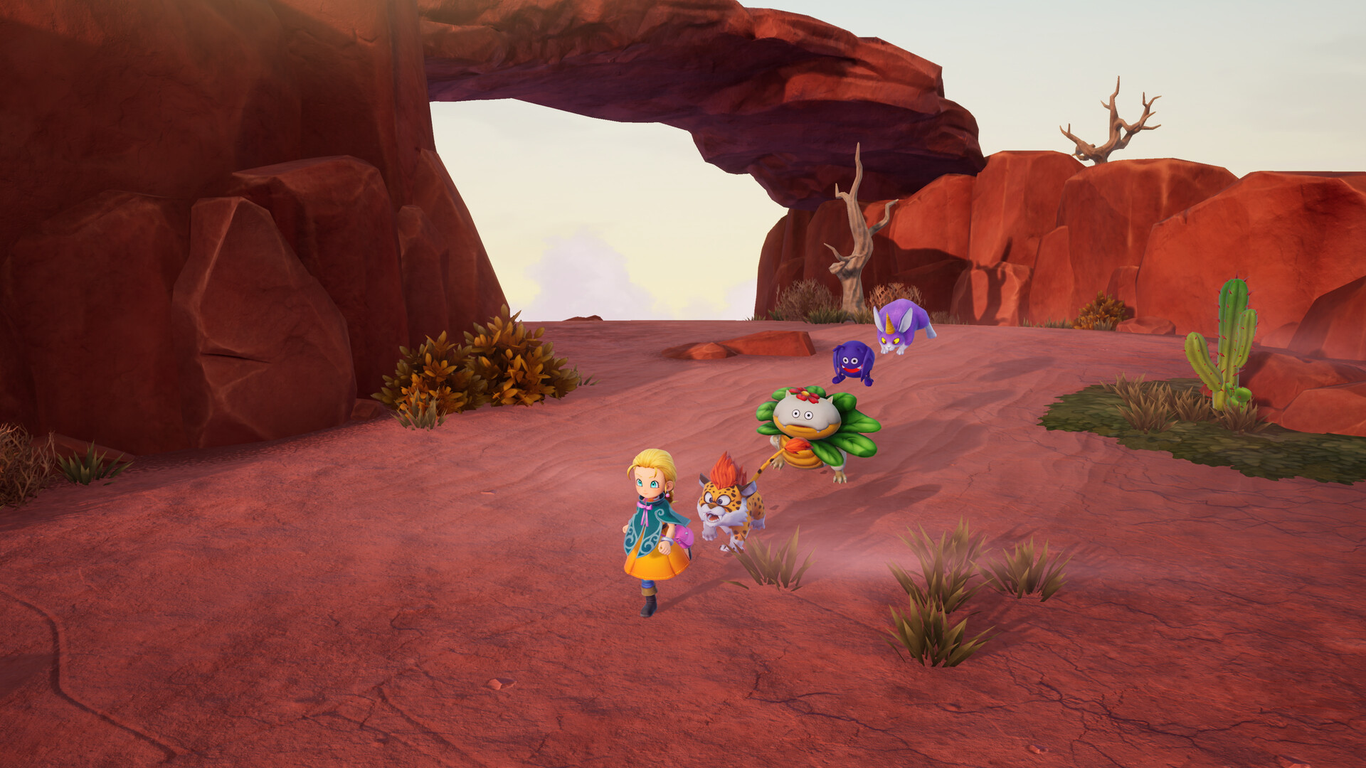 A monster wrangler walking through an arid red-rock canyon with three recruited monsters following behind her