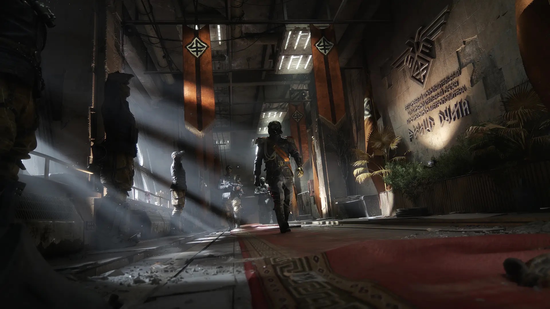 Hunter, in a decorated Novoreich uniform and gas mask, walks a red carpet through a Metro station hall hung with the regime's banners while masked soldiers stand guard.