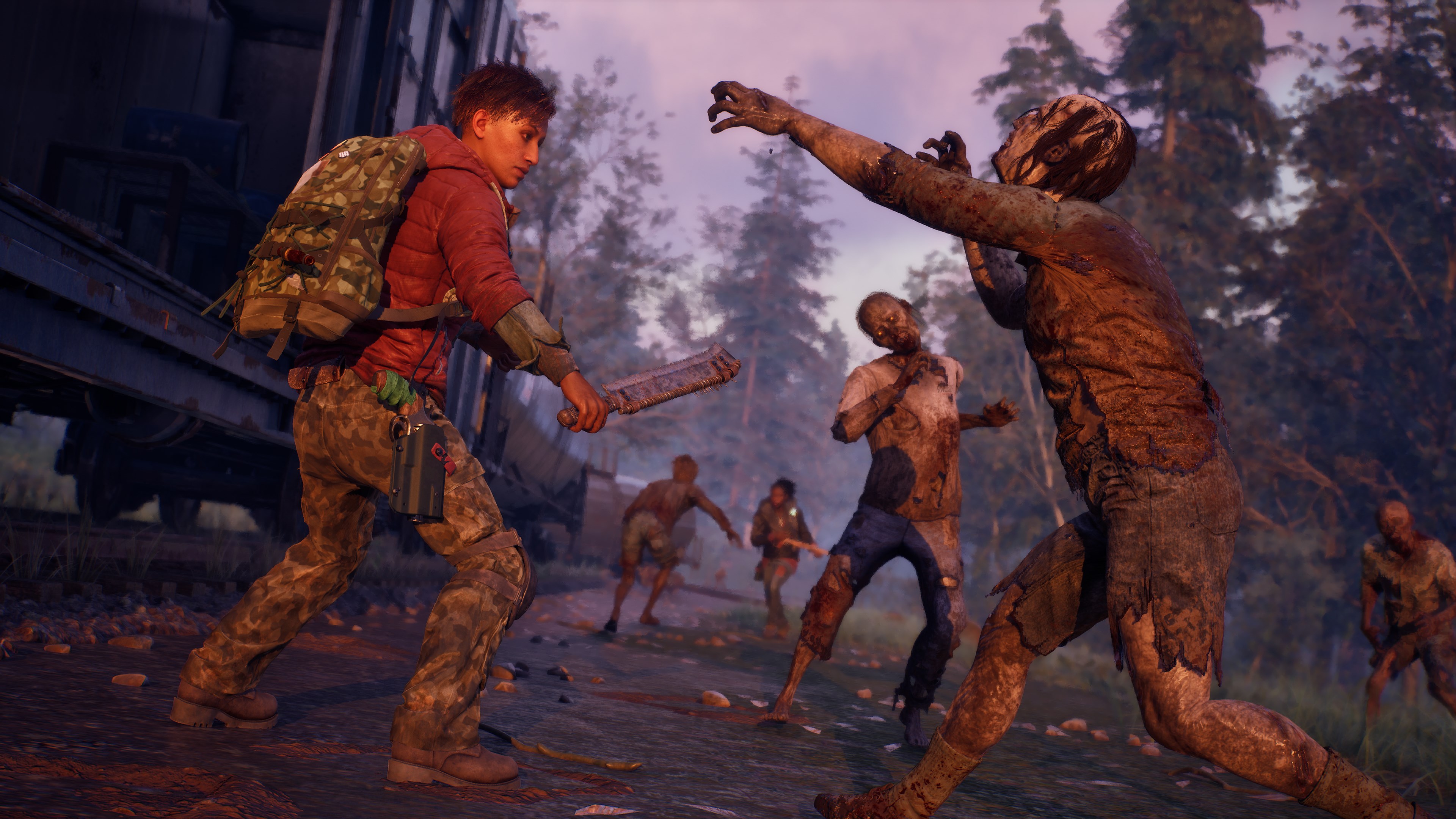 A survivor swings a bladed melee weapon at a dried-out zombie at dusk while several more close in beside a rail car