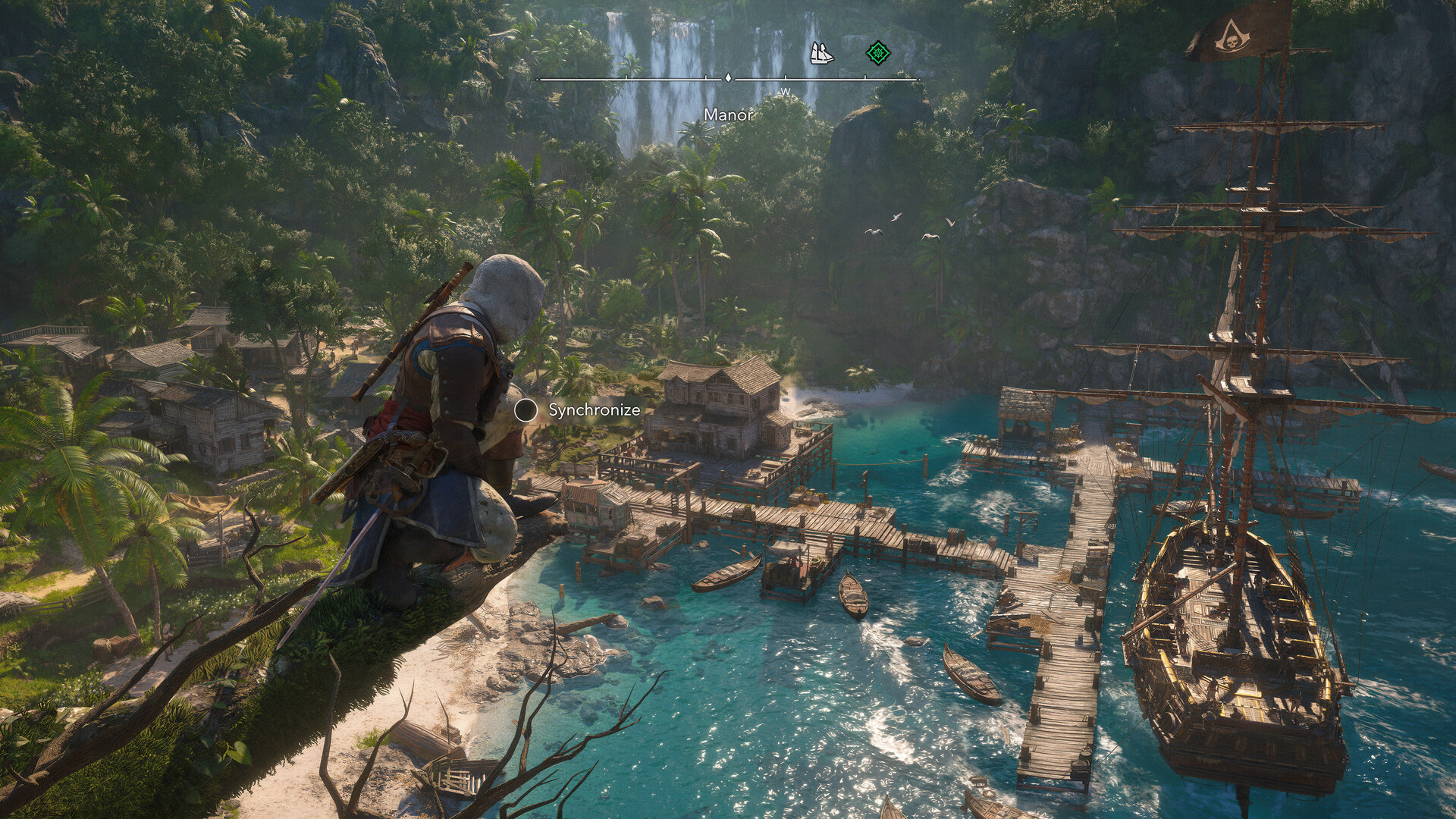 Edward Kenway crouched on a jungle branch above a pirate cove, with the Jackdaw moored at the docks below and a viewpoint synchronization prompt on screen