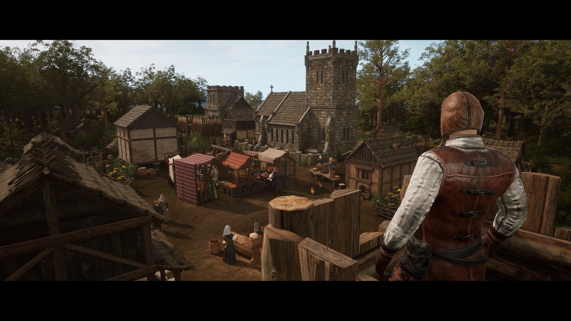 Stronghold 4 cinematic still: a village market square of timber-framed houses and stalls below a stone church tower