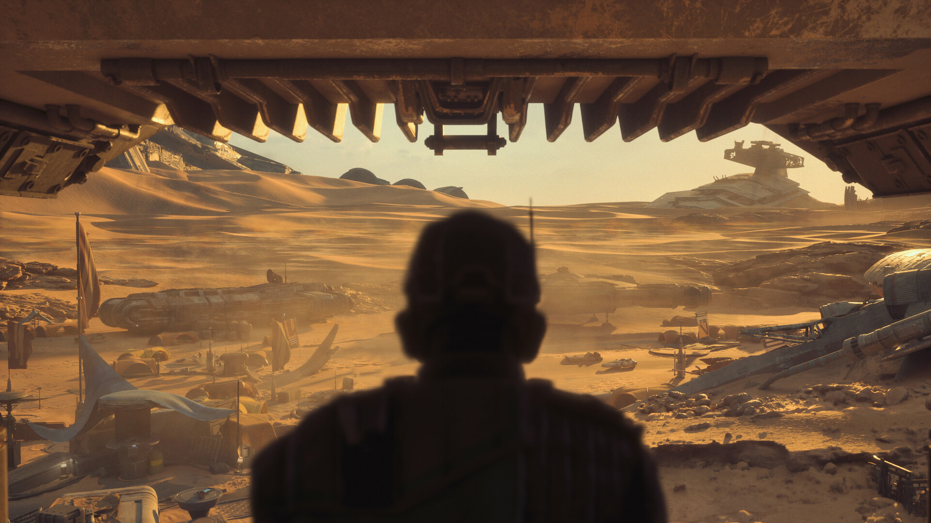 Figure looking out from wreckage over a Jakku settlement and a distant Star Destroyer