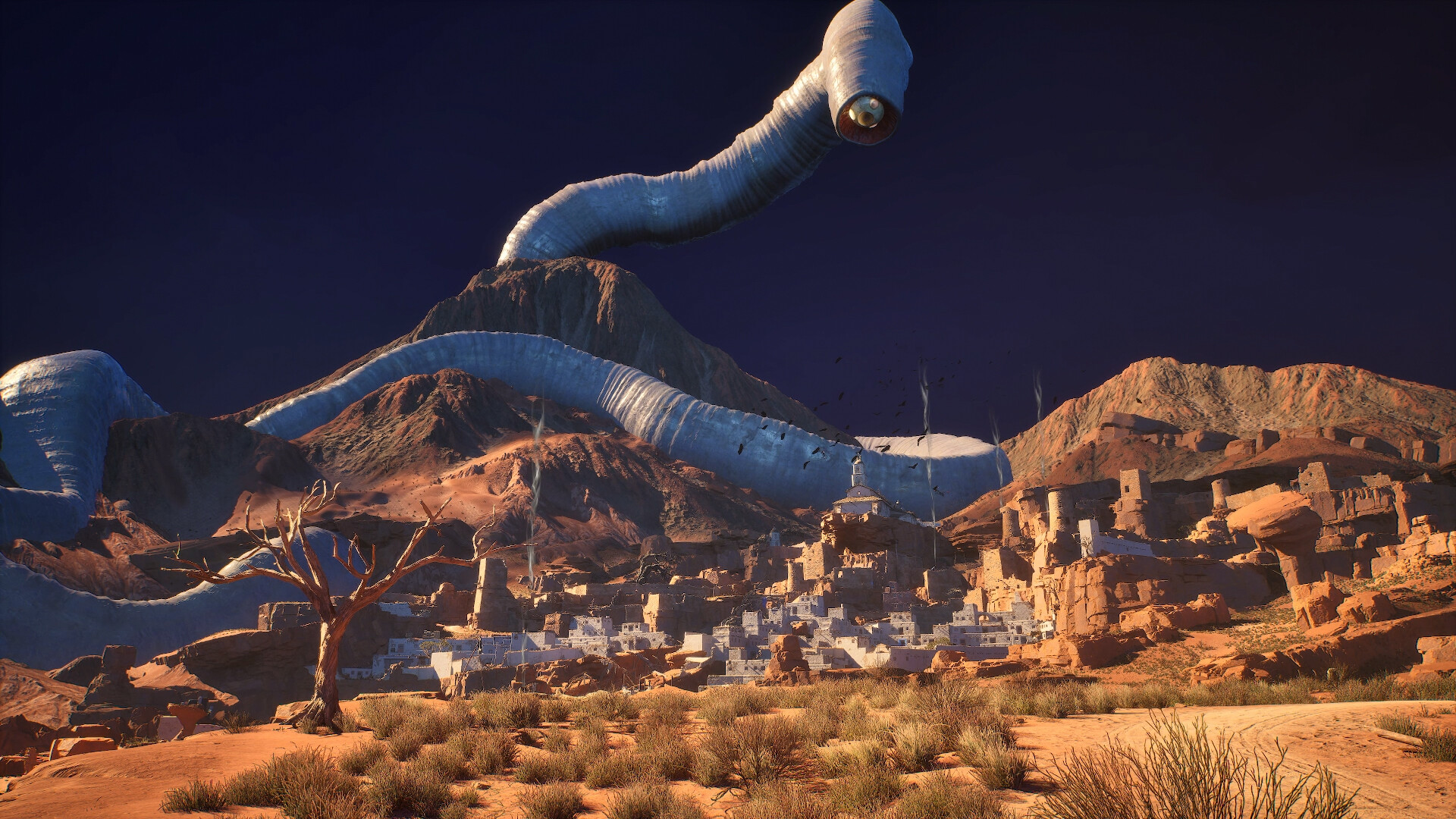 A desert settlement beneath immense pale, tube-shaped forms.