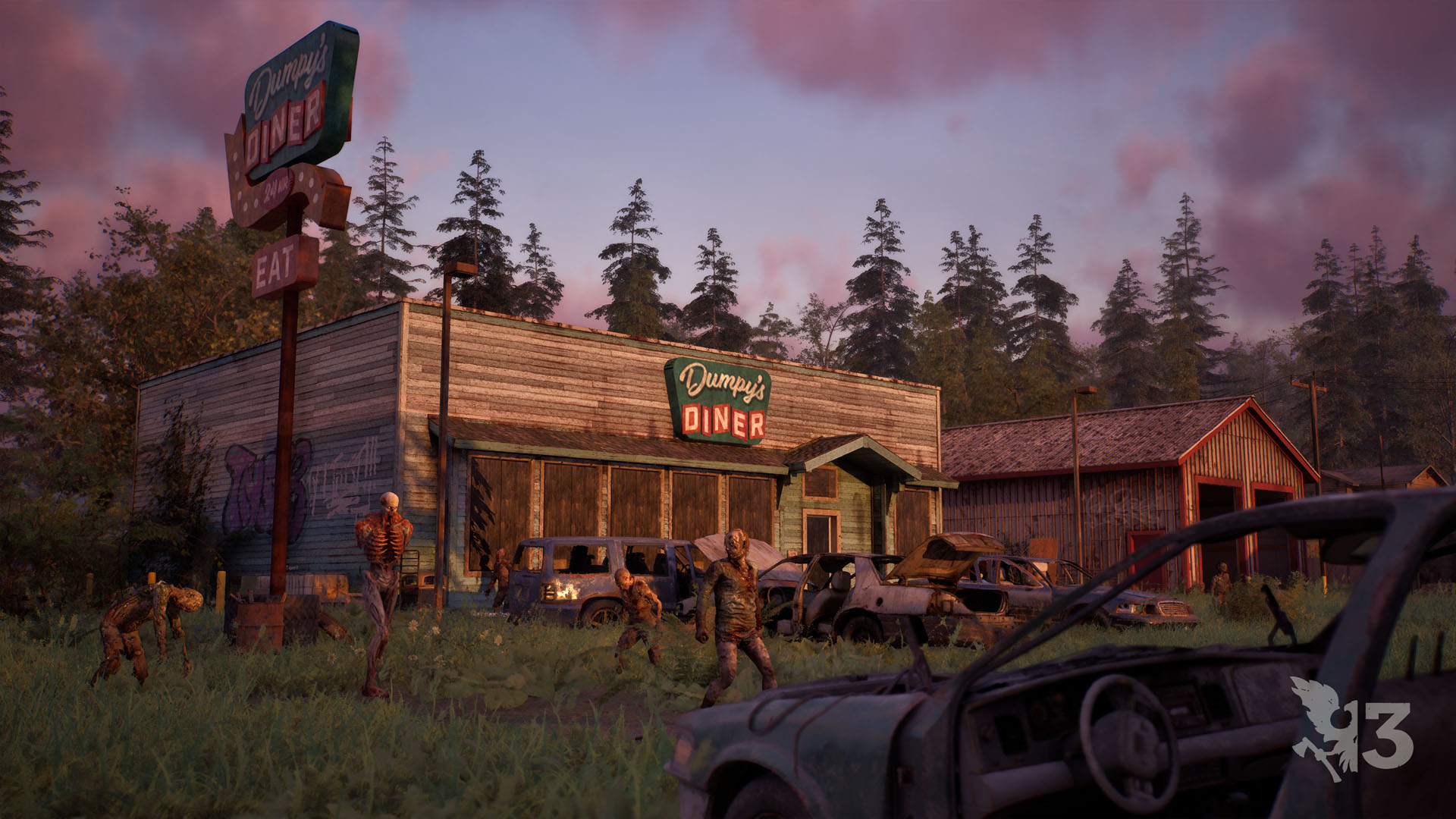 An abandoned roadside diner at dusk with its tall neon sign still standing, wrecked cars across the overgrown lot and several zombies wandering between them.