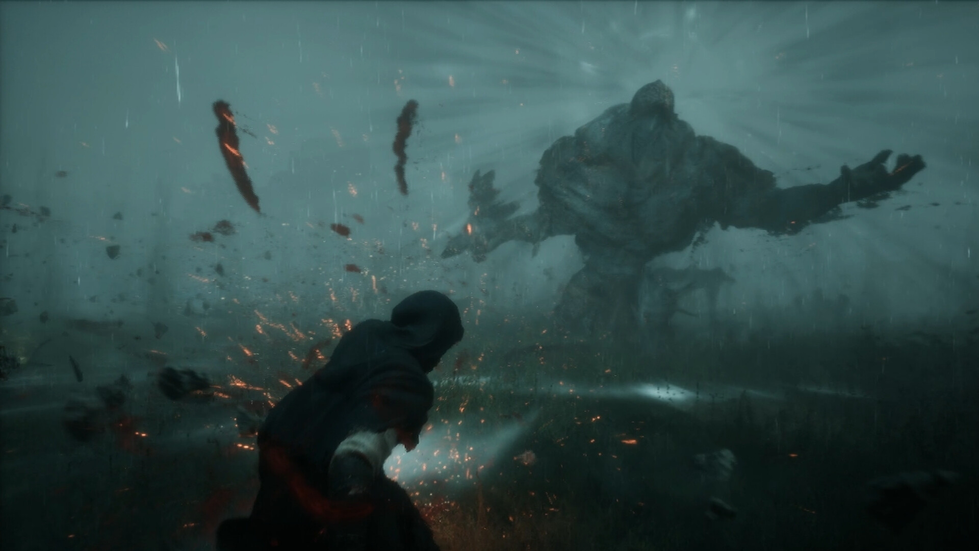 A colossal rock-skinned humanoid strides through driving rain and mist with one arm outflung as the Guardian braces in the foreground amid flying embers and debris.