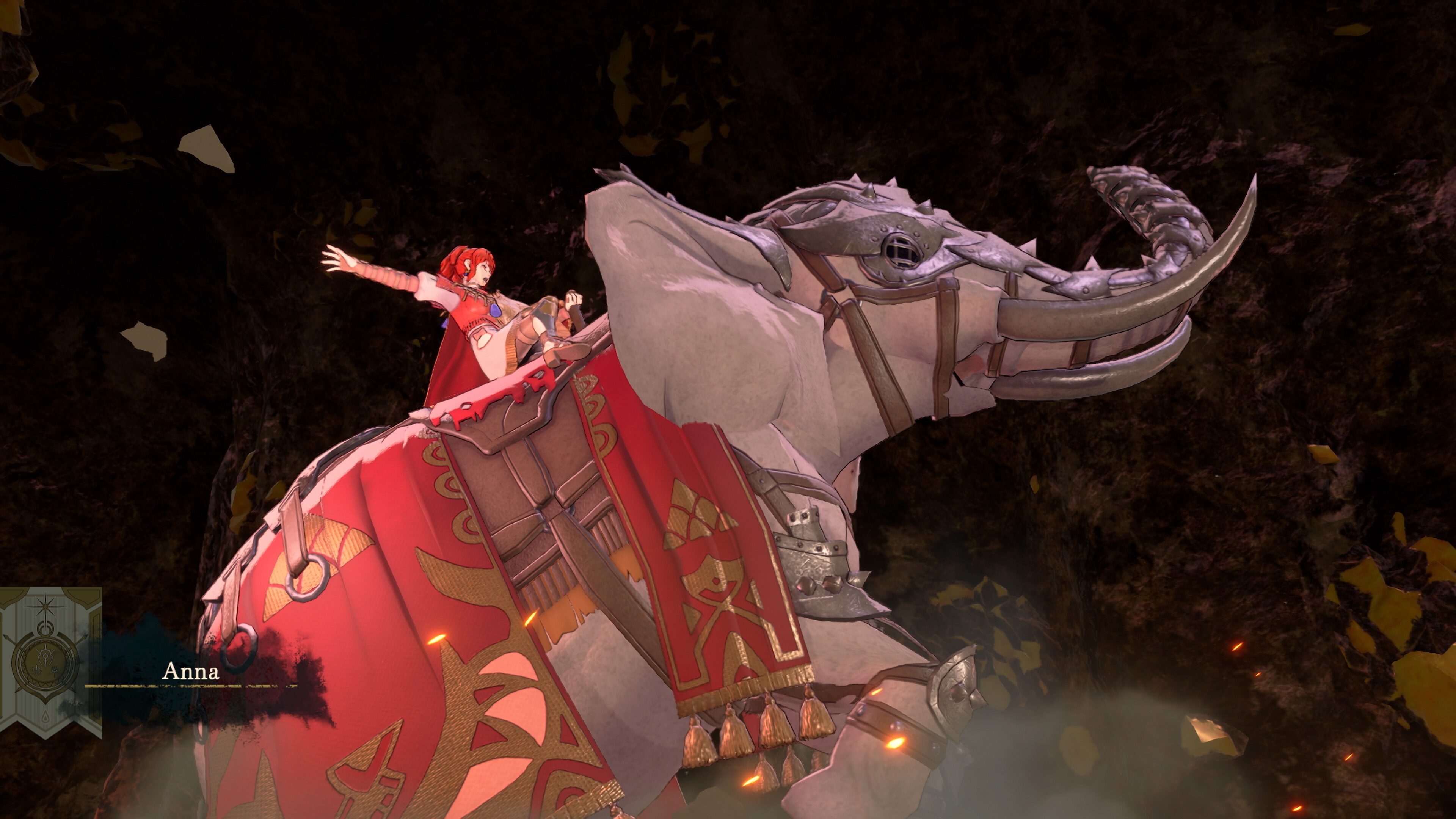 Anna riding an armoured war elephant in red and gold caparison through a dark cavern