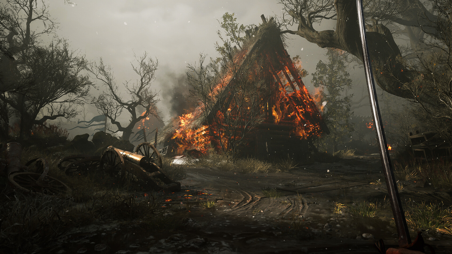 A thatched cottage burning down in a misty forest of bare, dead trees, with a field cannon toppled off its carriage and loose wagon wheels sunk in the mud of the track