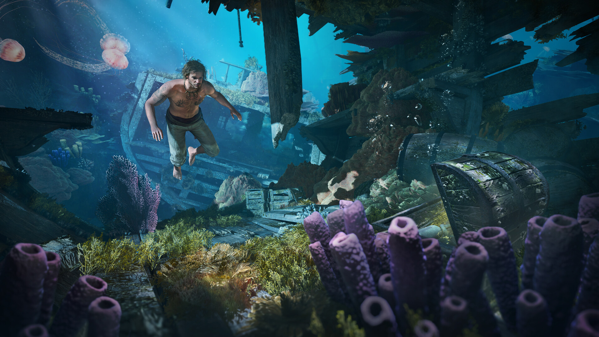 Edward free diving through a sunken wreck surrounded by coral, sponges and jellyfish, with a treasure chest resting on the seabed
