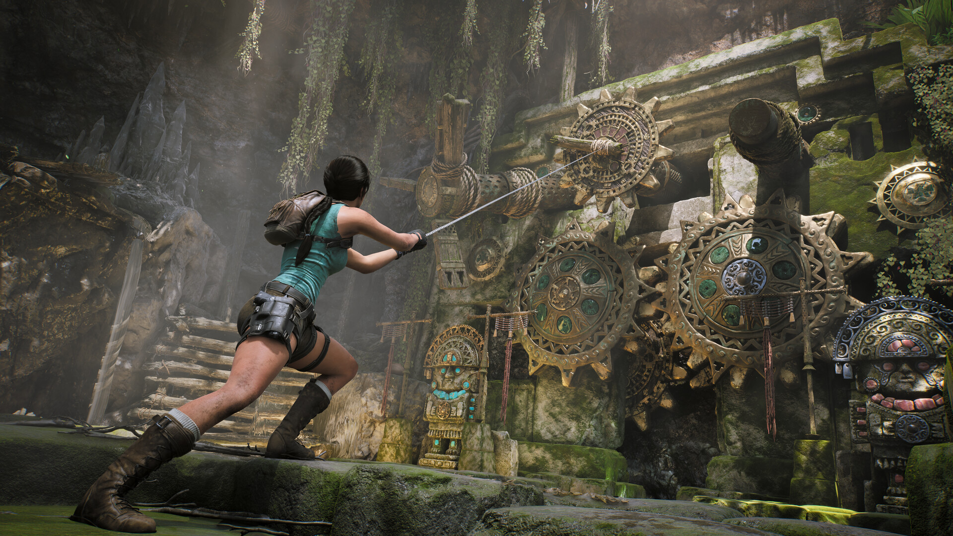 Lara Croft hauls a rope line attached to an Incan gear assembly during the cog puzzle in Peru's Lost Valley
