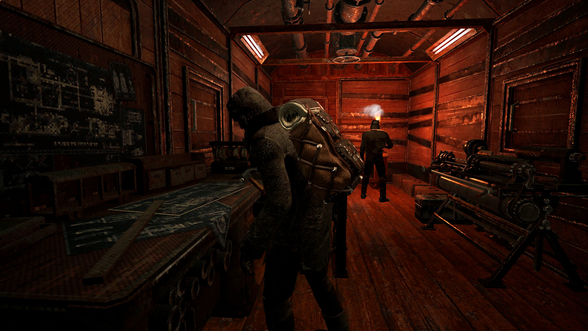Players inside a train carriage fitted with workbenches in Frostrail