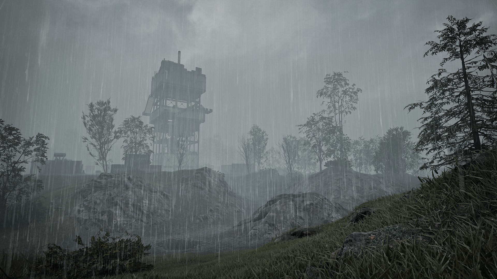 A grassy hillside under heavy rain with an industrial tower fading into the mist, showing the Season 2 rain weather preset in WARDOGS