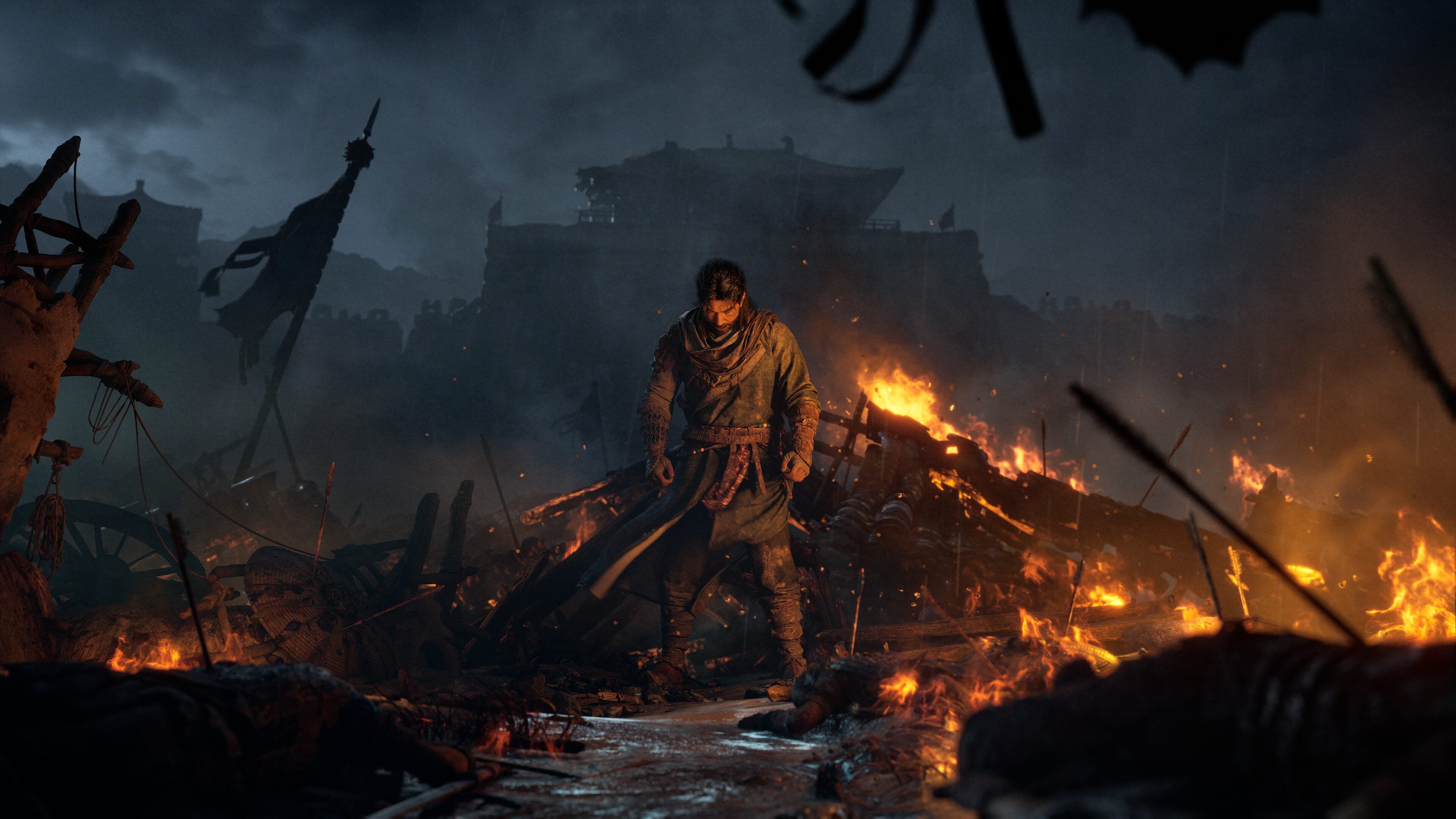 Father standing amid the smoldering ruins of a burning Tang frontier village at night during the Shazhou uprising