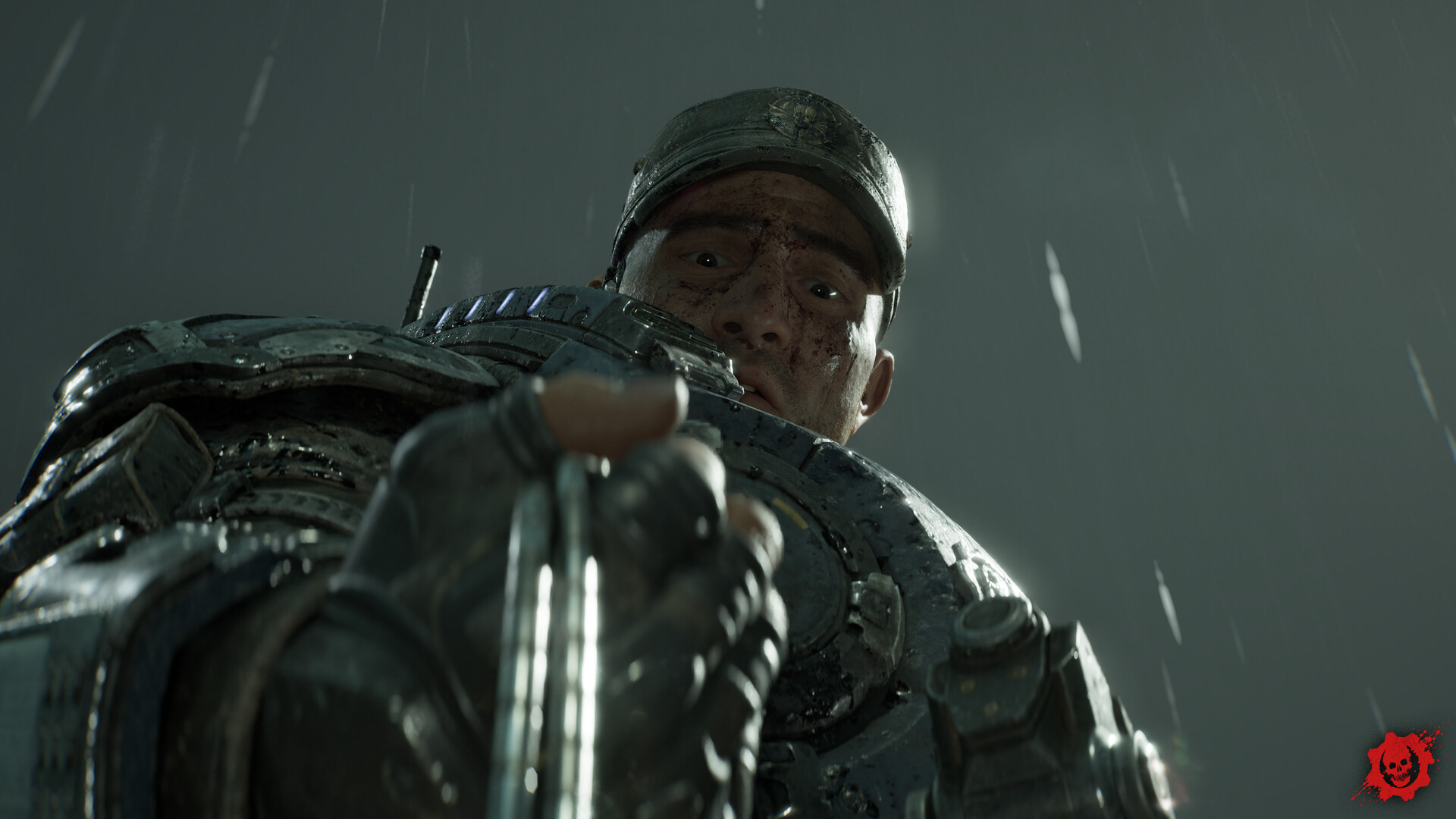 A rain-soaked COG soldier in a peaked cap reaches down toward a fallen Gear