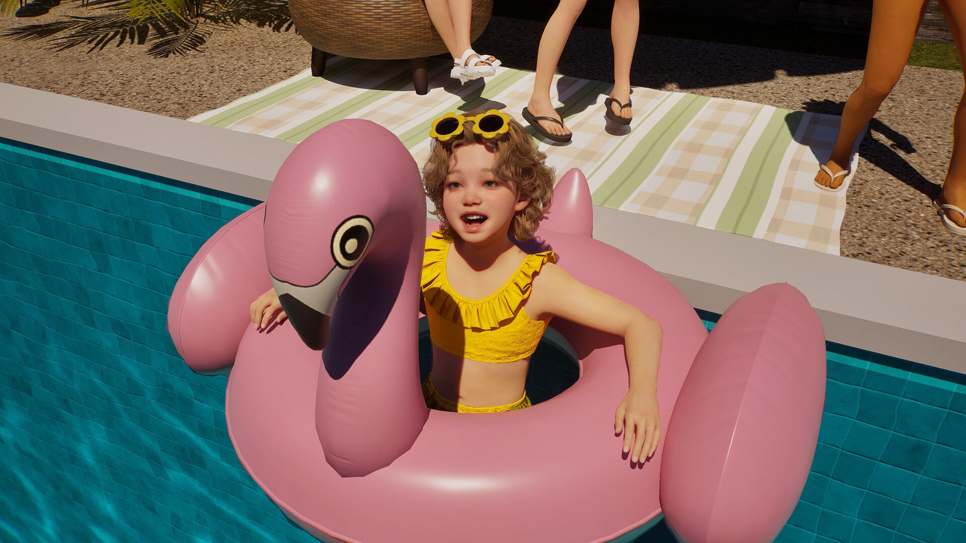 A child Zoi playing in a pool with a pink flamingo float