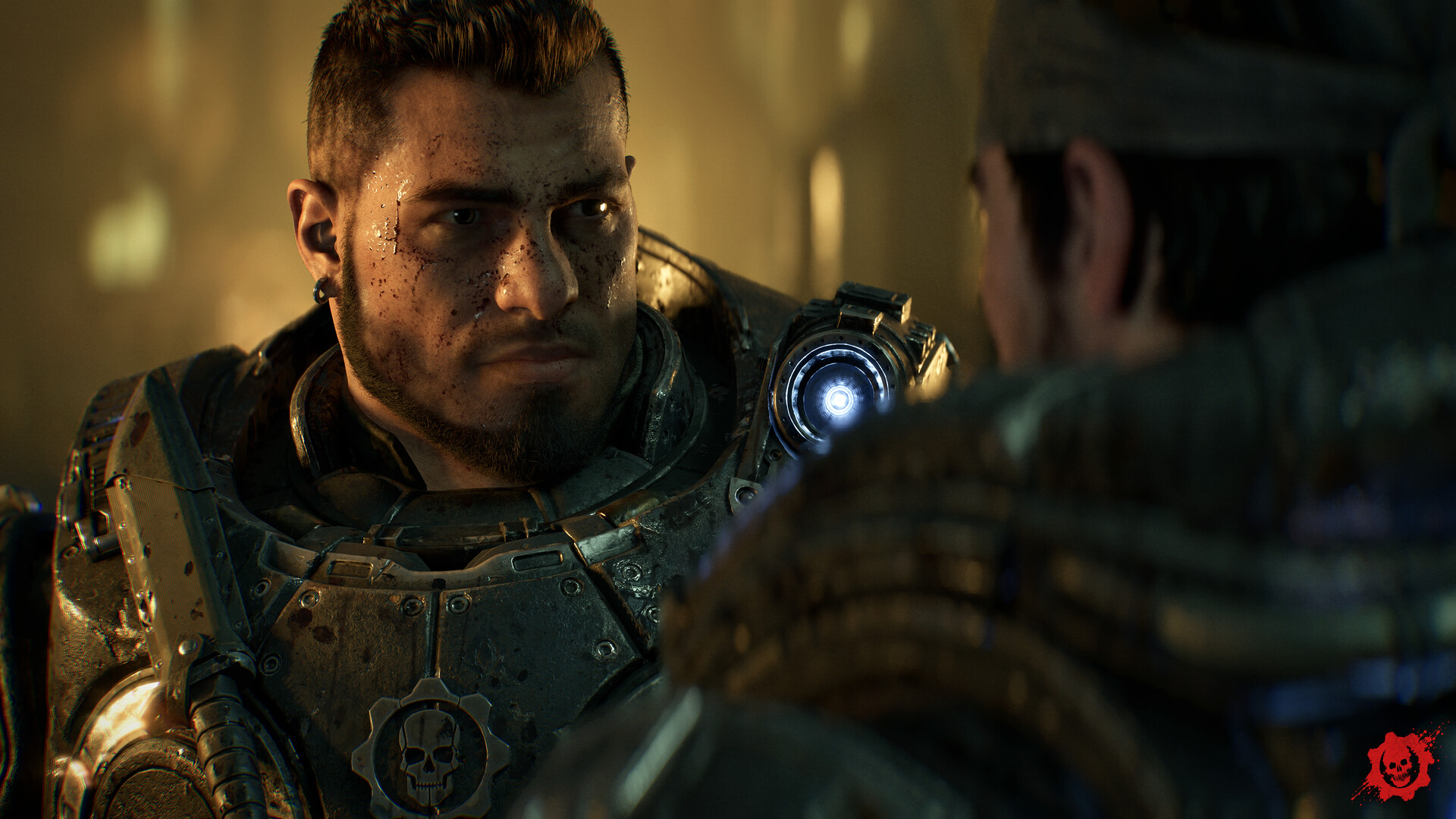 A Gear with a COG emblem on his chestplate speaks face to face with a squadmate in a firelit interior
