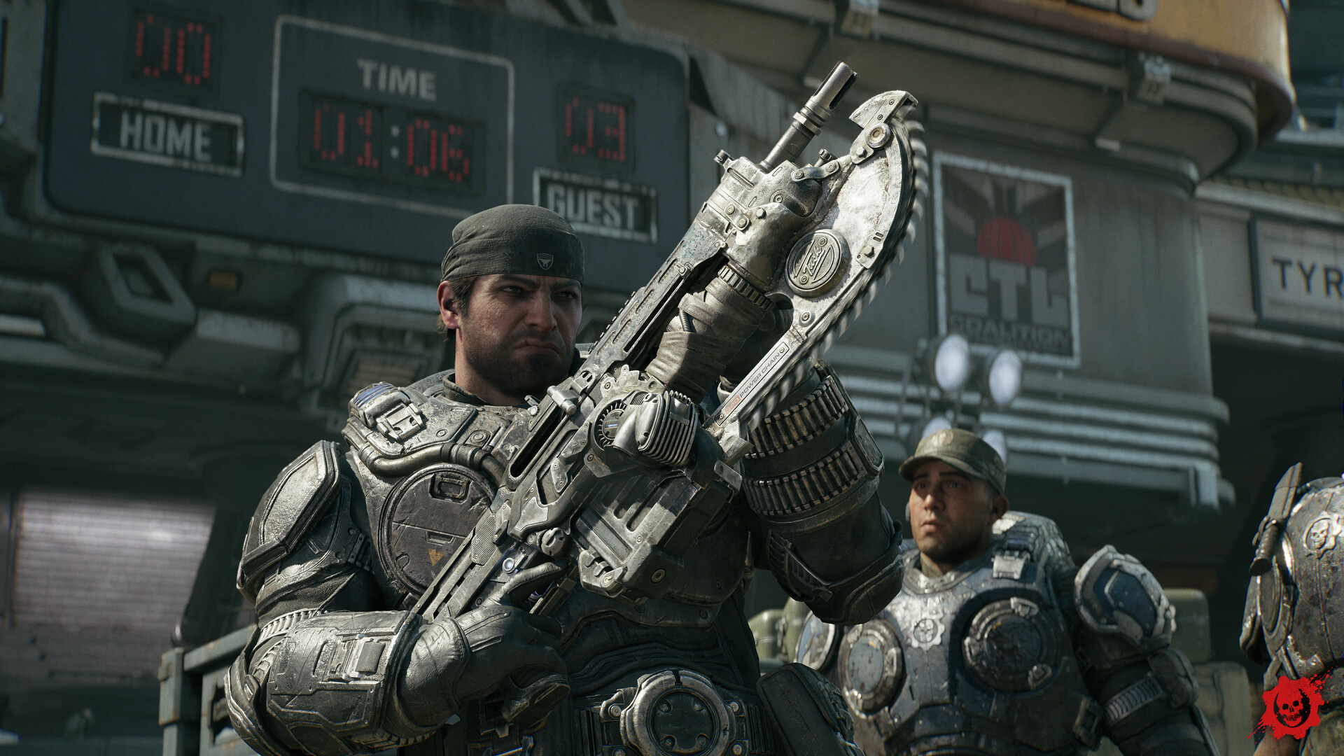 A Gear shoulders a chainsaw-bayonet rifle in front of a stadium scoreboard while other soldiers gather behind him