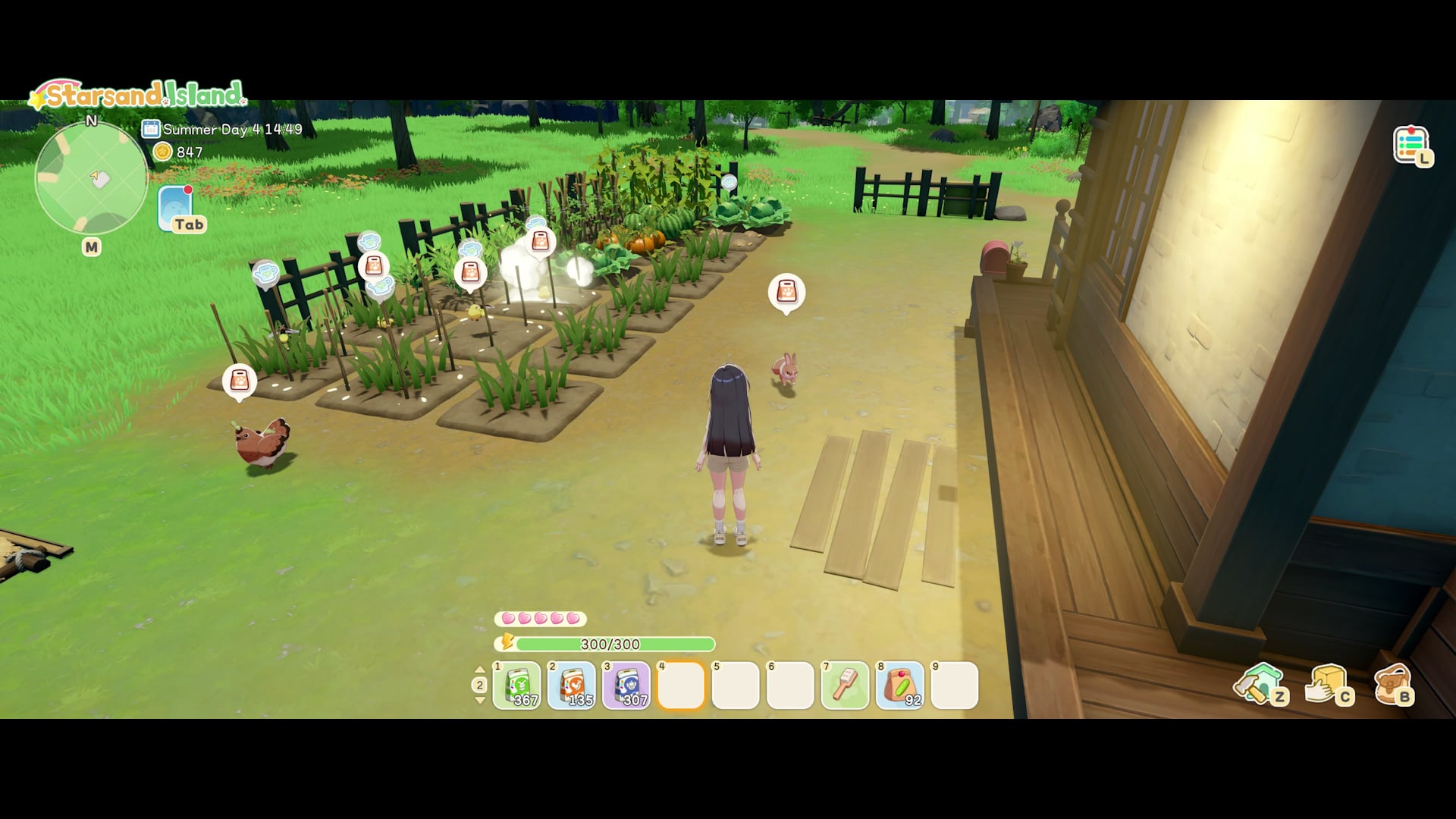 Overhead view of the farm with crop plots, sprinklers, and the homestead building