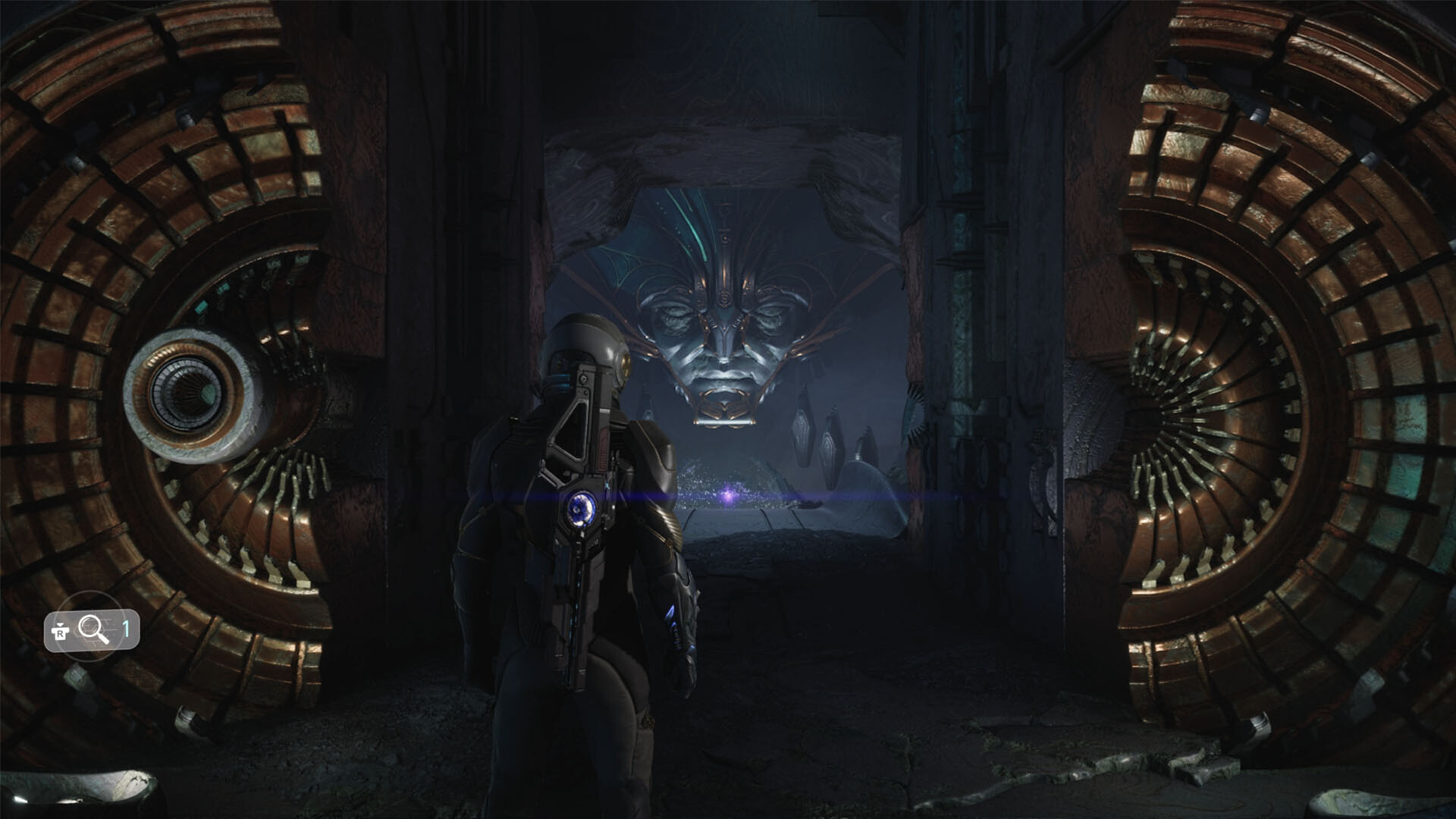 A Traveler stepping through an opened Celestial vault door toward a colossal carved face at the far end of the chamber, with the scan prompt shown in the corner