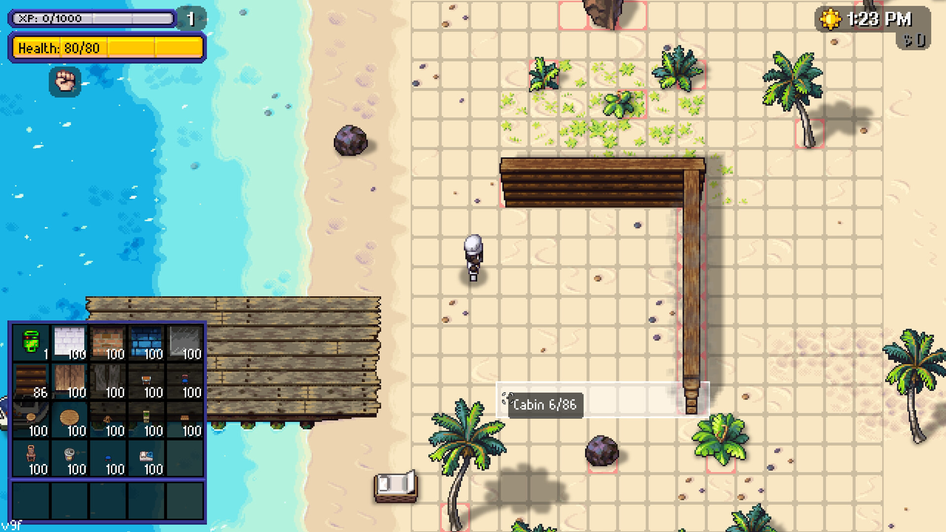 Build Mode active on a beach plot in Streets of Rogue 2, showing the tile placement grid with red boxes marking blocked squares, a partly built wooden wall, a build inventory of materials and objects with per-item counts, a Cabin 6 of 86 tooltip, and a clock reading 1:23 PM