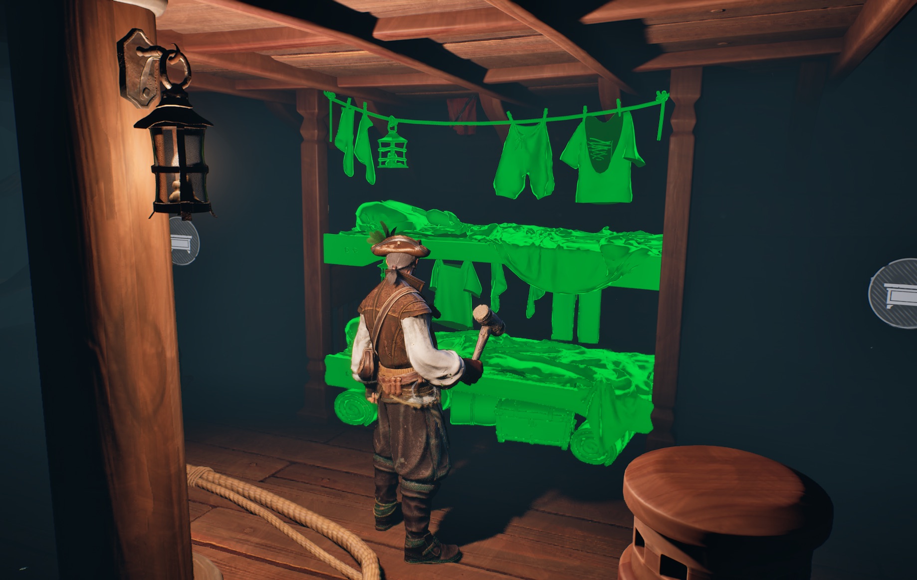 Work-in-progress preview of placing bunks and hanging laundry at a designated building spot below deck, planned for the Ashlands update