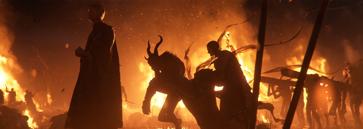 Still from the Diablo V announcement teaser showing a robed figure and a horned demon amid a burning battlefield