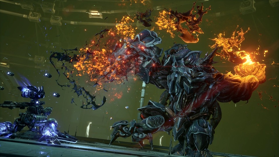 Gundam Helix fires on a large Apocalypse creature erupting in orange flame inside a green-lit interior hall