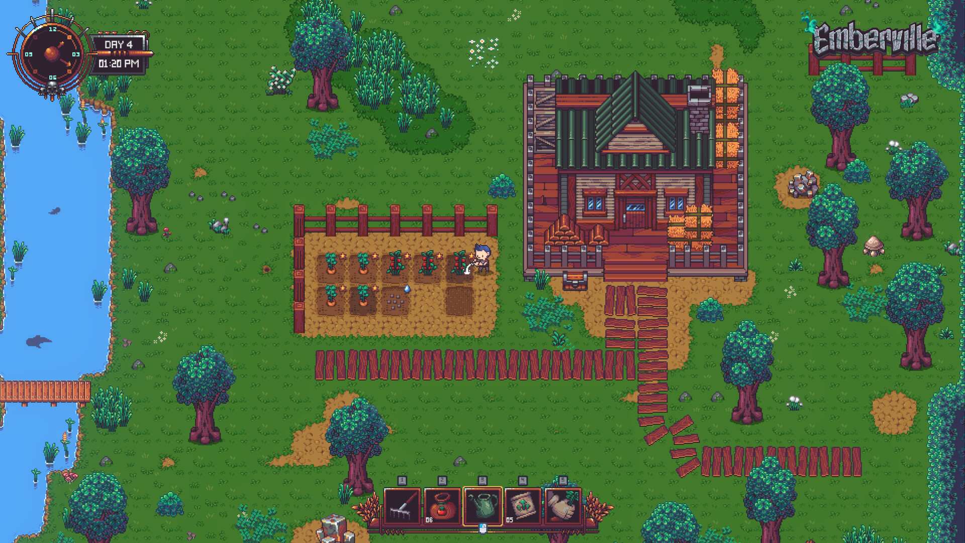 The player tending a fenced crop plot beside a wooden house next to a river
