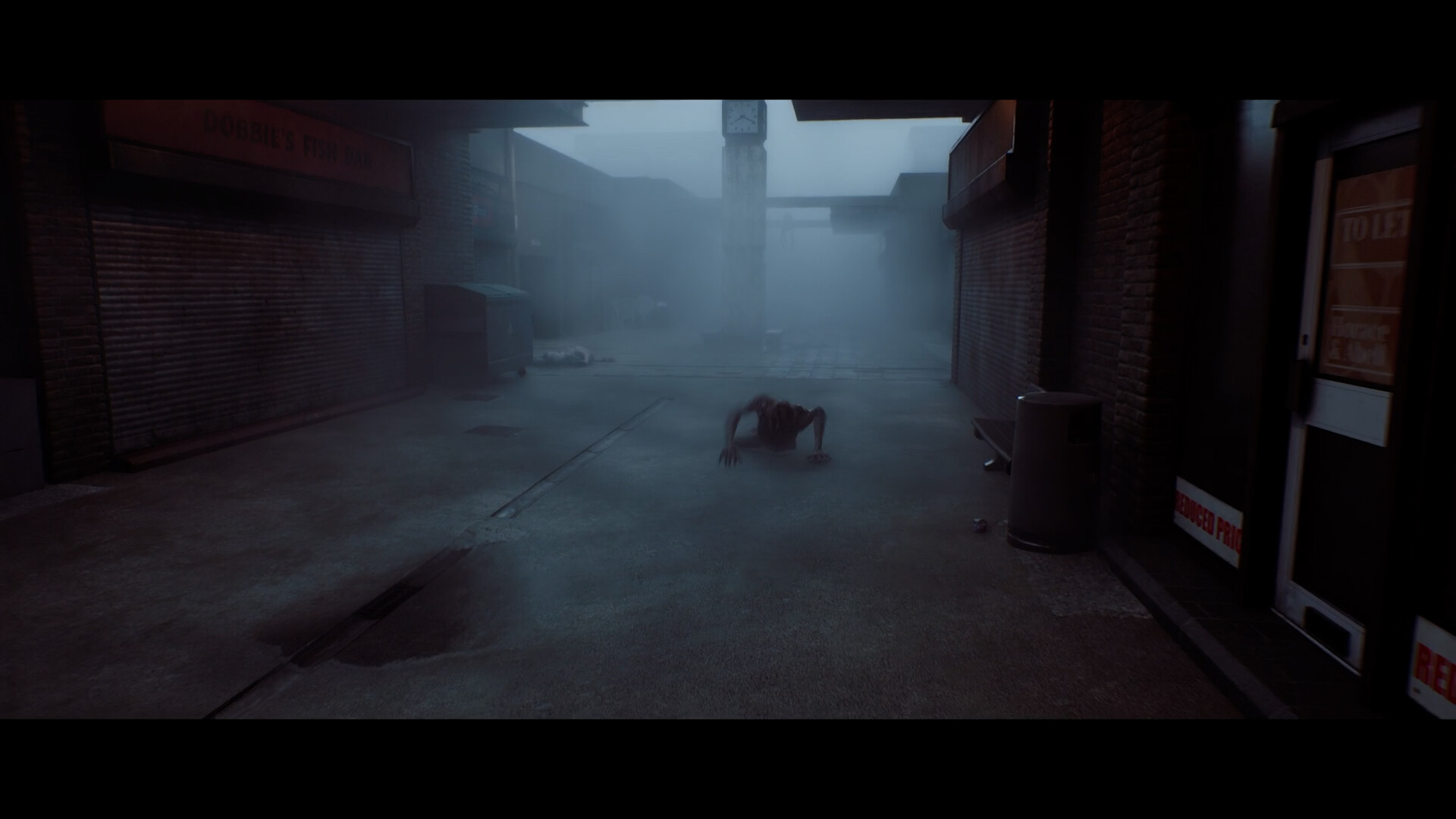 A crawling figure in a shuttered, fogbound shopping street