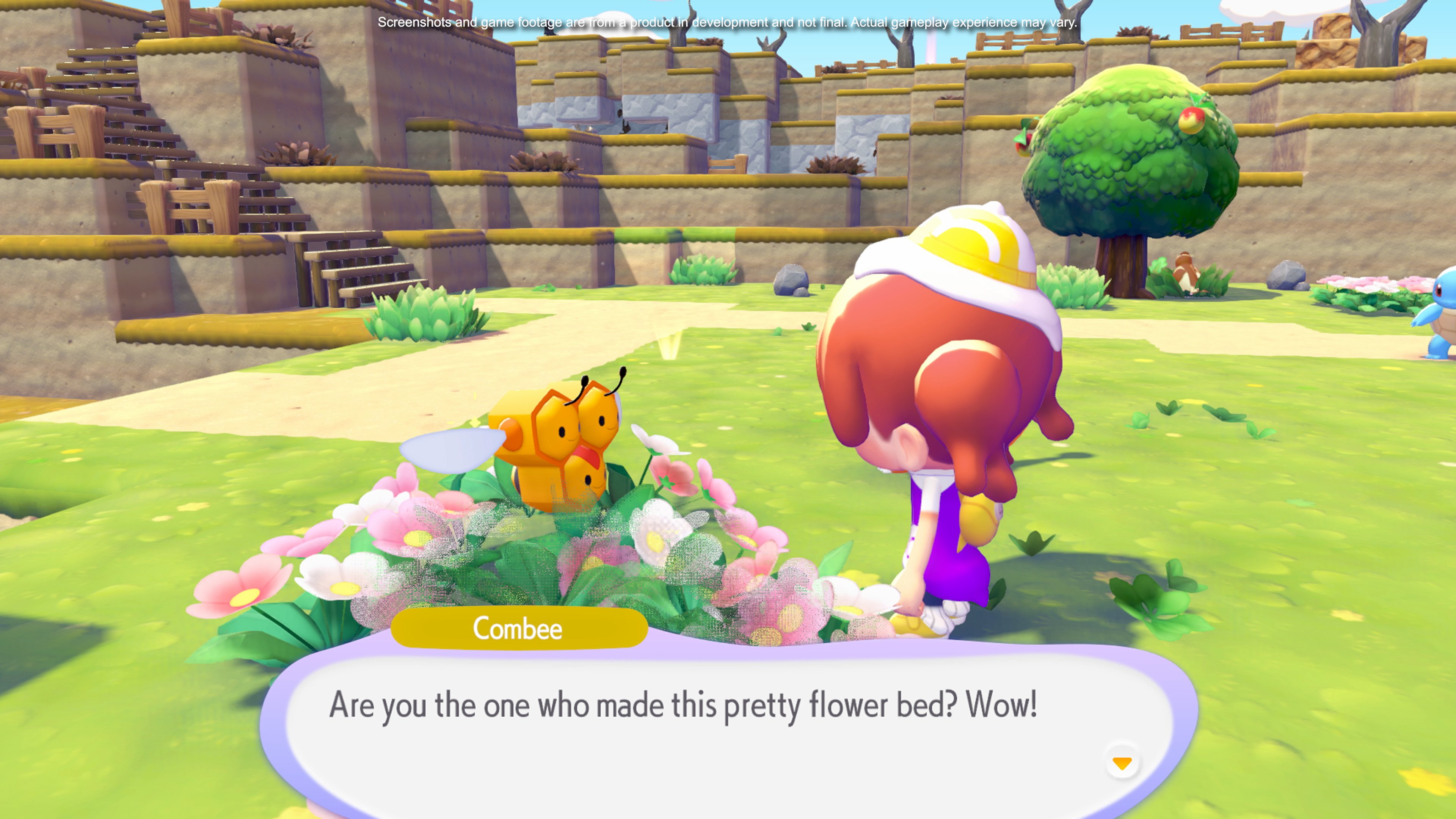 Combee visiting a flower bed created by the player, with pink and white flowers blooming around it illustrating the Litter specialty that drops honey