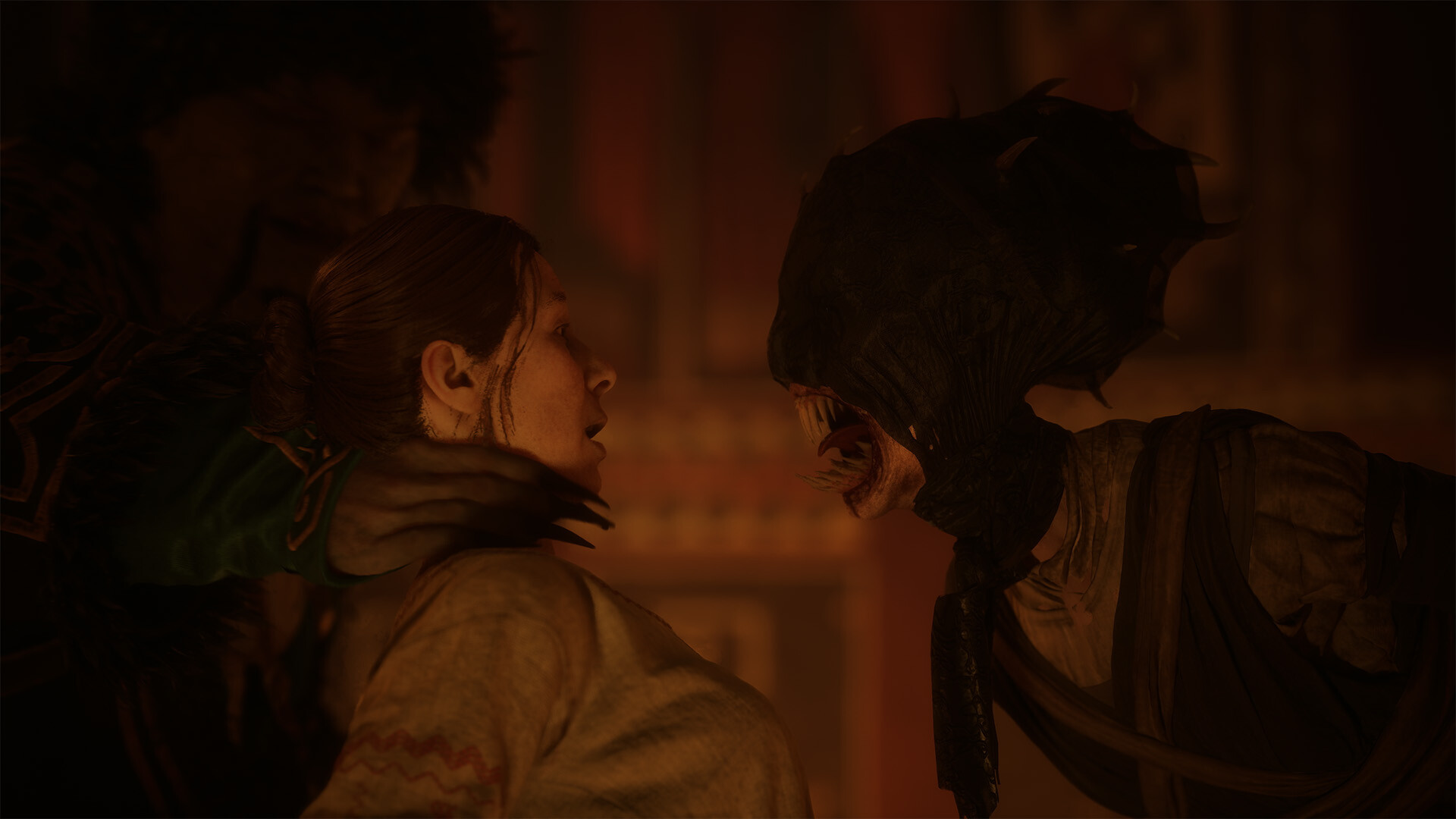 A transformed vampire snarling face to face with a terrified woman held fast in a warmly lit interior