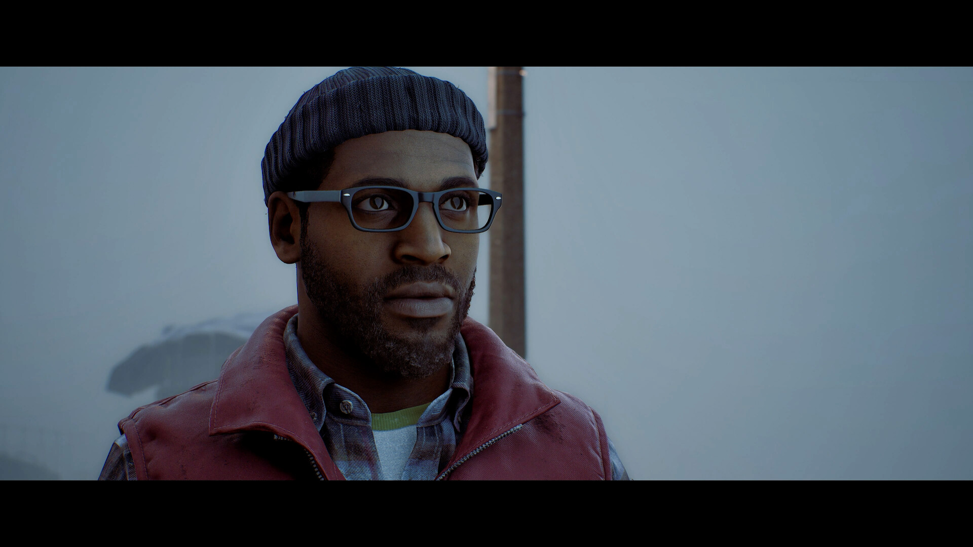 Simon Ordell in a knitted cap and glasses, standing in fog on St. Amelia