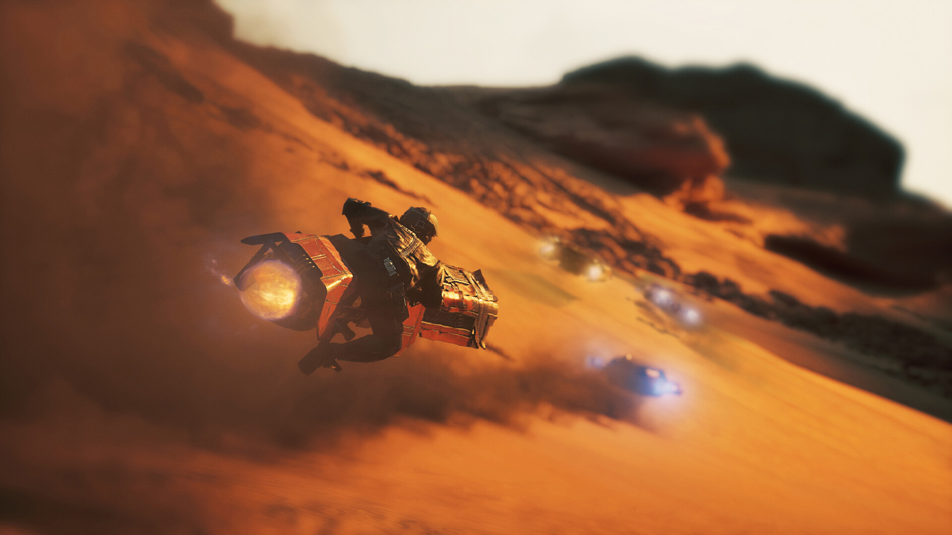 Speeder bike rider carving an orange Jakku dune as rivals close on blue thrusters