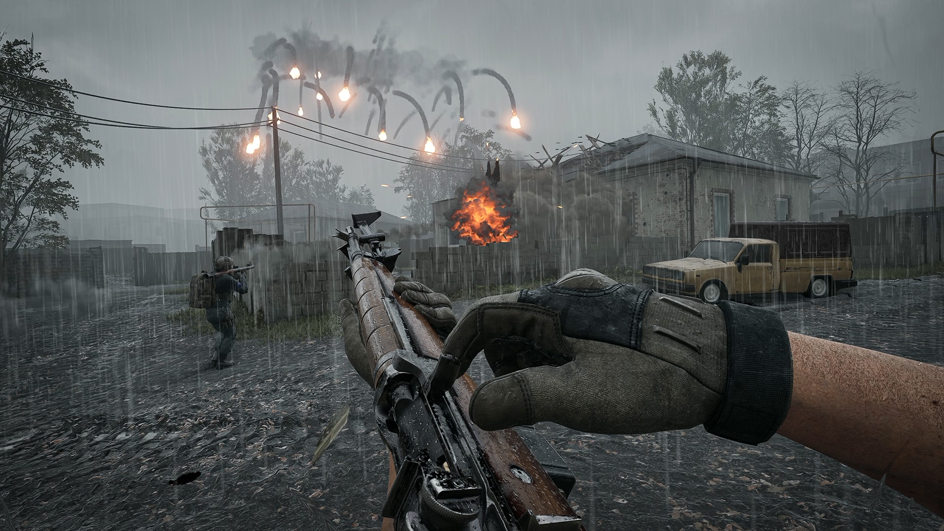 First-person view of the wooden stocked M14 designated marksman rifle in the rain as flares fall over a burning village in WARDOGS
