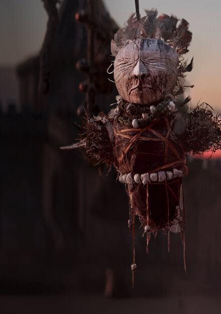 Official Divinity artwork showing a bound ritual effigy hanging above a hazy settlement at dusk